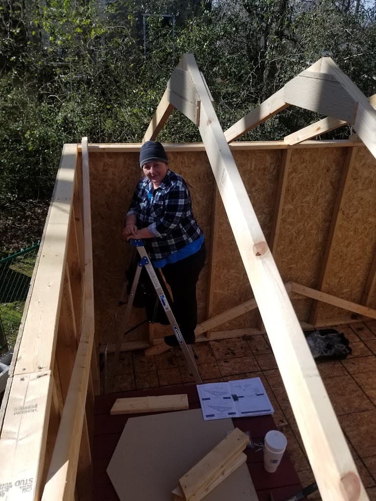 Ken Home Improvement crew member framing a shed roof on site